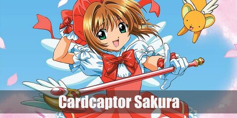 Cardcaptor Sakura wears a pinafore dress with petticoat, a huge bow, and a pair of long socks with red shoes. She also holds her staff and tops off her look with a beret.
