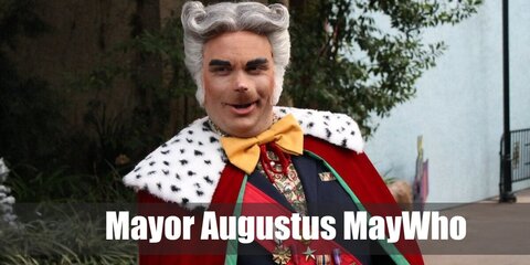  Mayor Augustus MayWho from Whoville’s costume is a long-sleeved white button-down shirt, a modern-fit blue suit, a peach vest, black oxford leather shoes, a red sash, a gold bow tie, and a red king’s robe.
