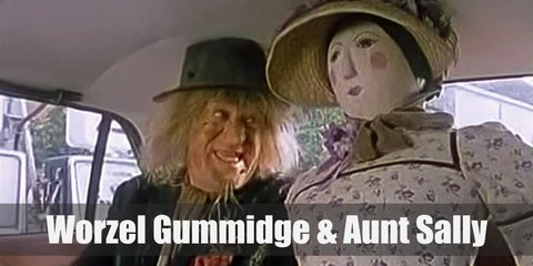  Worzel Gummidge costume is a dirty suit and lots of hay to show that he is, indeed, a scarecrow. Aunt Sally wears a simple colonial dress, a farmer’s hat, and formidable boots. 