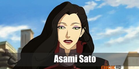 Asami Sato’s costume is a burgundy turtleneck top, a burgundy midi skirt, grey tights, knee high black boots, a single-breasted black blazer, and a black waist belt. '