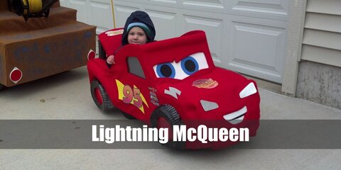  Lightning McQueen’s costume is a Lightning McQueen-themed pajama set, red and white sneakers, a red racing cap, fingerless sports gloves, a Lightning McQueen 3D disguise, and sunglasses.