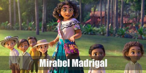  Mirabel Madrigal’s costume is a white ruffle top, a turquoise maxi skirt, wedge sandals, a gold-rimmed pair of sunglasses, and a brown bag across her shoulder.