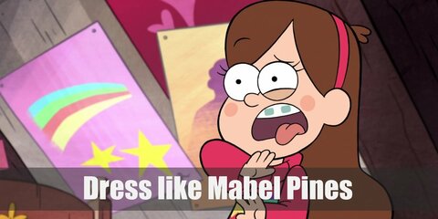 Mabel Pines’s costume is a pink sweater with a shooting star design, a light purple skirt, and black ballet flats.  