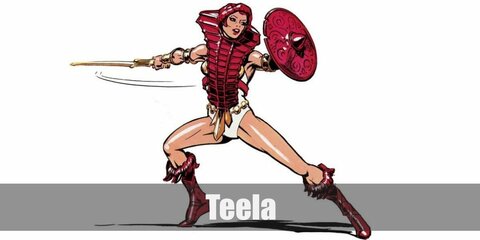 Teela’s costume features a white bodysuit topped with a golden bra and accessories. She also wears brown boots and carries a shield and a weapon.