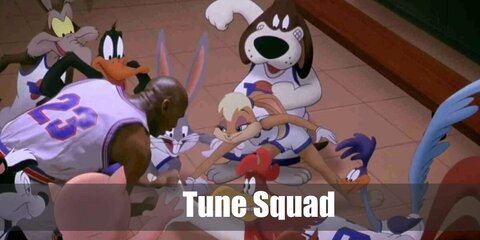  Tune Squad’s costume is a white themed basketball jersey, white themed basketball shorts, knee-high white socks with triple blue and red stripes, white and blue basketball shoes, and red, white and blue headbands and wristbands.