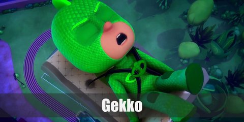 Gekko of PJ Masks' costume includes an all-green body suit and a reptile scales on the head as headband. He also has green elbow pads to recreate his shields as well as matching knee pads. To complete his look, wear a green tail and green shoes.