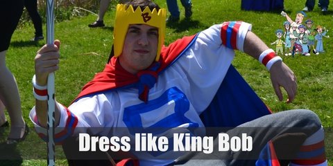 King Bob`s royal attire consists of a hockey jersey, loose jogging pants, a crown-shaped helmet, and a hockey stick as a scepter
