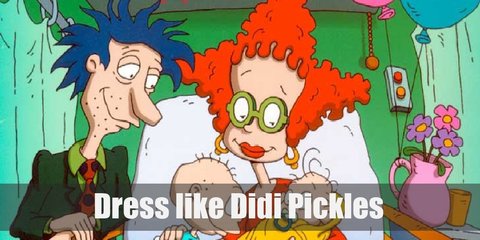 Didi Pickles wears a beautiful red long-sleeved calf-length dress, orange bracelets, red ankle-length socks, brown shoes, a yellow-orange pearl necklace, and round green eyeglasses.