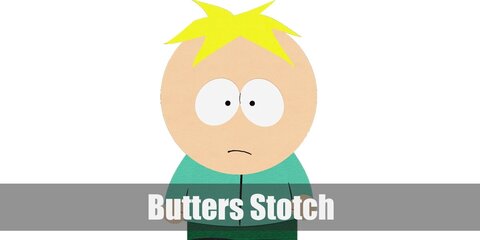 Butters Stotch wears a casual turquoise top and green pants styled with a pair of dark shoes. He also has a lump of yellow hair.