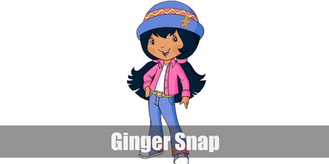 Ginger Snap’s costume is a pink jean jacket, a white undershirt, blue bellbottom jeans with a yellow belt, blue sneakers, and a blue hat with a pink ribbon around it and attached with a gingerbread man.