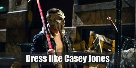 Casey Jones costume is a sleeveless denim vest over his plain white tee, light gray pants, and a hockey mask in front of his face. 