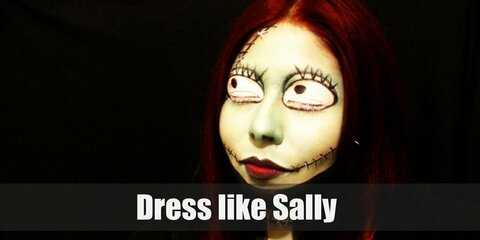 “Sally costume is patchwork dress, blue tights, body paint, black booties and red hair wig.”