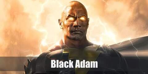 Black Adam’s costume is a black body suit with a lightning bolt on the chest, a black cloak with gold trim, and golden boots. 