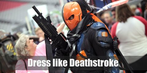 Deathstroke's costume is a black bodysuit with orange armor parts and mask. 