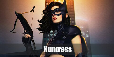  Huntress (Helena Bertinelli)’s costume is a black fitted sleeveless mid-rib top, black leather pants, a black leather trench coat, black combat boots, a black utility belt, and black half-finger gloves.