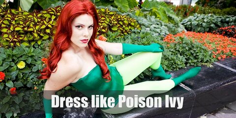 Base on her style in Batman & Robin movie, Poison Ivy has long bright red hair with bright green nails and green outfit.