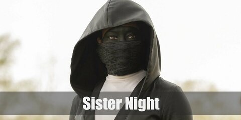 Sister Night costume is a black mask, beads dangling from the waist, as well as a pair of boots to complete costume.