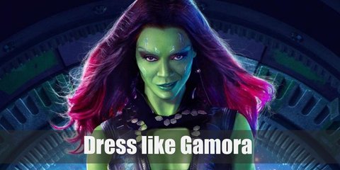 Gamora’s outfit looks like a mix between explorer and goth. She loves her leather. She wears a black bustier, black pants, black boots, and a dark long coat which stands out against her green skin. 