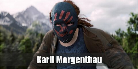  Karli Morgenthau’s costume is a blue camo top, a brown bomber jacket, cargo pants, and the Flag Smasher mask.