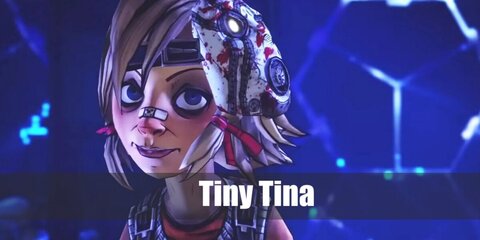 Tiny Tina's costume can be recreated with a blonde wig, a forehead band, a pink top, and brown tube top. She also has arm warmers, a bib on her brown skirt, bottoms, and mismatched footwear.