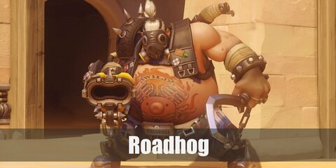  Roadhog’s costume is grey cargo pants, black combat boots, his iconic gas mask, studded bracelets, and a chest harness that carries his weapons of choice.