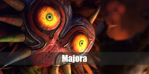 Majora's costume features a mask, orange top,green shorts with matching gloves, and a pair of pointy shoes.