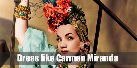 A lot of Carmen Miranda outfits are a long, flamenco-style skirt, with a cropped or bra-style top that is bedazzled or has flounces along her shoulders.