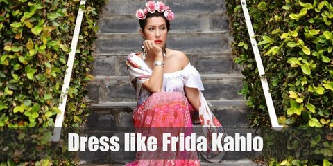 For your own beautiful Frida Kahlo costume, you will need a Latina style skirt and top, lots of intricate and nature inspired jewelry, and an iconic rose or flower headband to top it all off