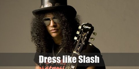 Slash isn’t just an icon in the music industry but a fashion trendsetter as well. His trademark curly hair and top hat plus dark glasses are so well-known around the world that everybody knows ‘that’s Slash.’ 