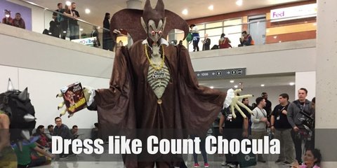 Count Chocula costume is a mostly brown get-up. He has on a white dress shirt, a brown suit, brown Oxfords, a brown ribbon, and a brown Victorian cape.  