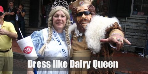  The Dairy Queen costume is regal queen dress with a red gown, a red cape, a giant red spoon as your royal scepter, and a crown made from red spoons. 
