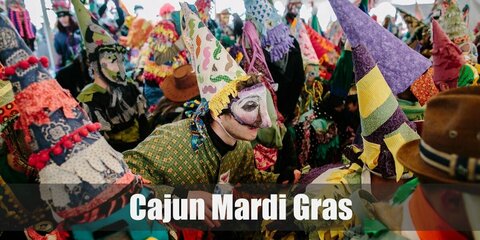 The Cajun Mardi Gras costume can be recreated by sticking strips of ribbon or crepe paper on the clothes and masks. Top it off with a cone hat and a mask!