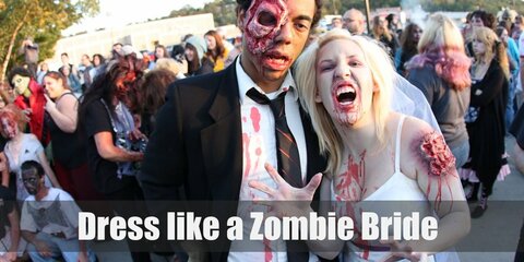 For a dead zombie bride costume, all you will need is a white silk top, a white maxi skirt, fake dirt and blood, white heels, and a veil.  