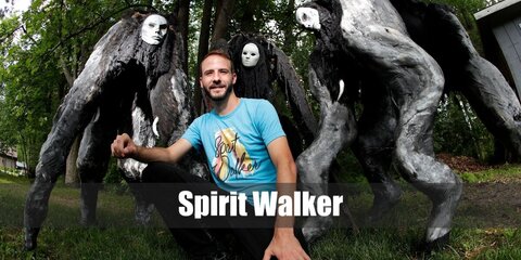  Spirit Walker’s costume is crutches, stilts, EVA foam, black fabric, a black shirt, black pants, and a white mask.