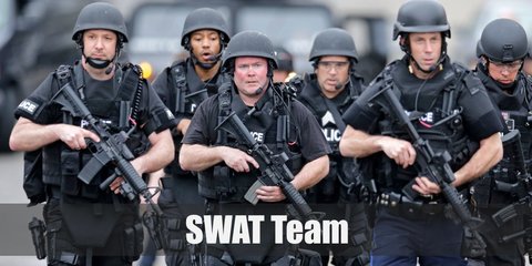 For SWAT Team costume force and grab a navy blue shirt and top it with a tactical best and cargo pants. Wear a SWAT-printed cap and fingerless gloves, too!