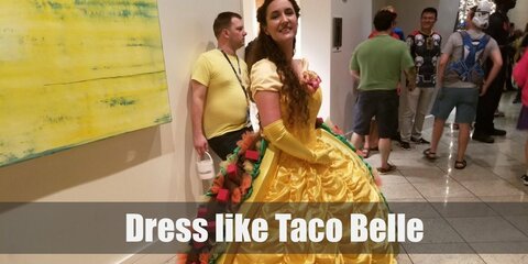 Taco Belle costume uses the gold ball gown from Beauty and the Beast and adds taco-like elements to it like green lettuce and red tomatoes.  