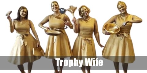 The trophy wife costume features a gold dress and a foot stool with trophy wife written on it.
