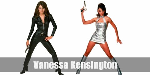 Vanessa Kensington’s iconic costume is shiny thanks to her silver dress and her matching boots. Her another outfit is a black catsuit pair with black boots.
