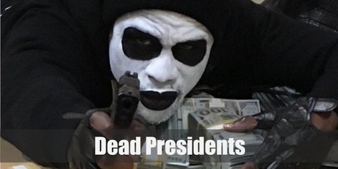  Dead Presidents gang costume is to wear a black sweater, denim pants, a zip-up jacket, a black beanie, and face paint. 
