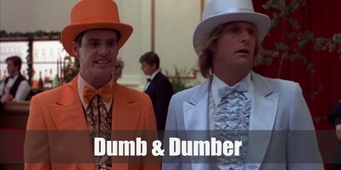 In their iconic 'suits scene' Lloyd Christmas wears an all-orange tuxedo, pants, and top hat. Harry Dunne wears a powder blue version of the tuxedo and hat set. They also carry matching canes.