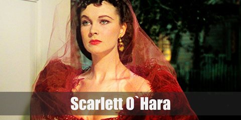  Scarlett O’Hara most known outfit is very ‘Southern belle.’ It is composed of a white layered dress with a green sash on the waist and a white floppy hat on her head.  