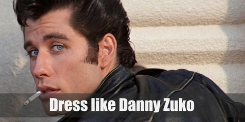 Danny Zuko costume is wearing a T-shirt tucked into black jeans with a black belt topped with his black leather jacket with the T-Birds logo on the back, and black penny loafers.
