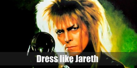  Jareth costume is gothic in nature. He wears a white top with ruffles, a blue Victorian coat, black dress pants, and black boots.  