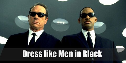  Agent J and Agent K wear identical outfits as this is the standard uniform of the Men in Black, the organization they belong in. They both wear a white dress shirt, a plain black tie, and a black suit while carrying weapons such as futuristic guns and etcetera.  