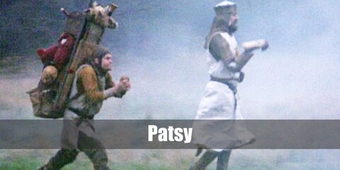  Patsy’s costume is a brown long-sleeved shirt, a medieval tunic, brown pants, and a brimming traveler’s backpack with a flag sticking from it. Make sure to bring coconuts, too.