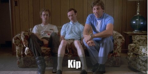  Kip’s costumes is a light blue polo shirt, khaki shorts, long khaki socks, and aviator glasses.