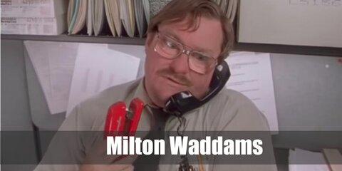 Milton wears a grey button-down shirt with pens on his breast pocket. Then, he styles the costume with a necktie, glasses, and a fake mustache. Carry a red stapler, too.