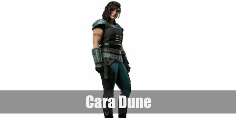  Cara Dune’s costume is a black shirt, black vest, blue armor, turquoise pants, and tattoos 