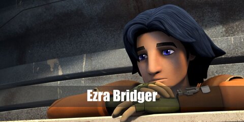  Ezra Bridger’s costume is an orange long-sleeved shirt paired with orange pants, brown boots, a brown vest, brown fingerless gloves, and his trusty lightsaber.