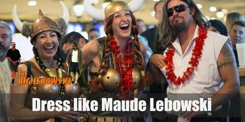 Maude’s Lebowski costume is the green robe she wears after her unforgettable entrance; as well as The Dude’s drug-induced dream of her wearing a Viking costume with bowling balls as a bra. 